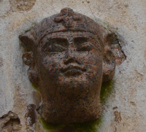 Head of sphinx with cross attached