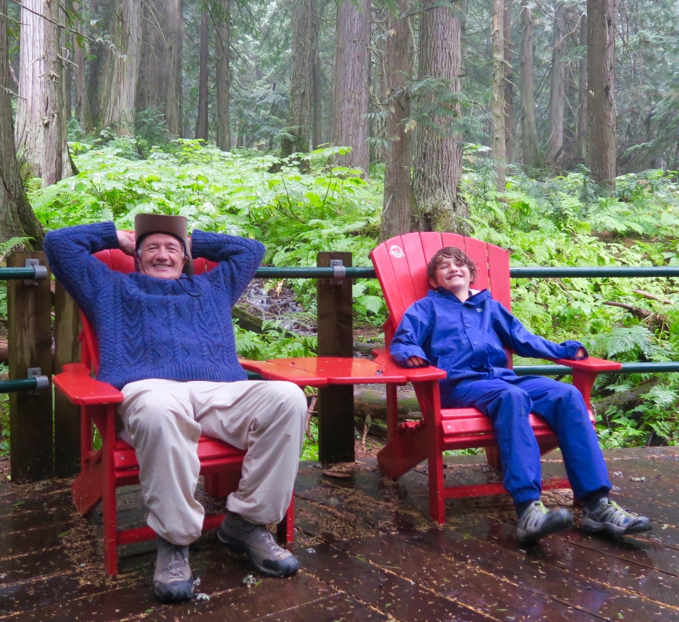 Relaxing in Hemlock Grove Red Chairs, Glacier National Park
