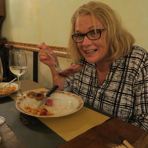 Anne Digs into her Florentine Steak