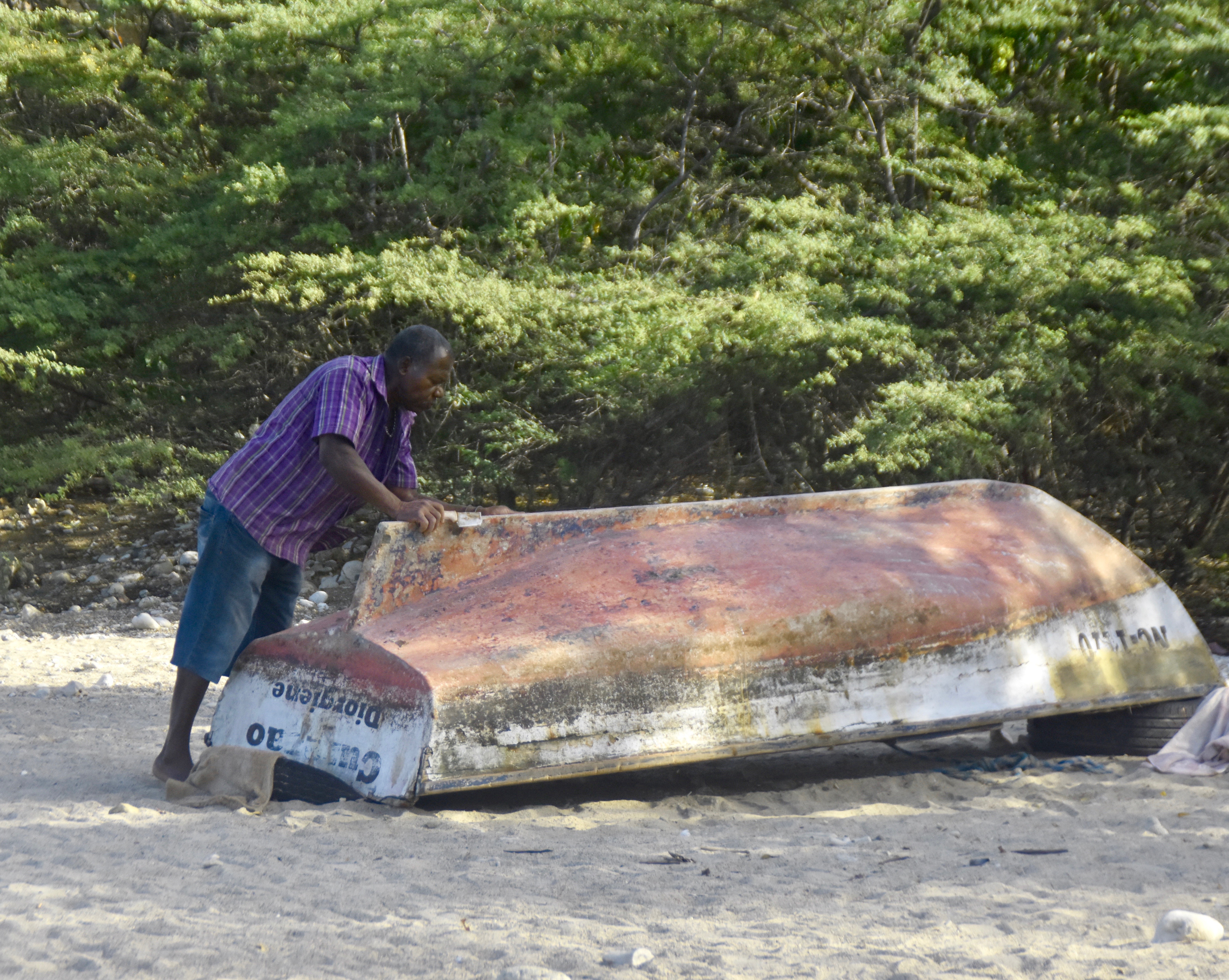 Fisherman Scrubbing His Boat, West Punt