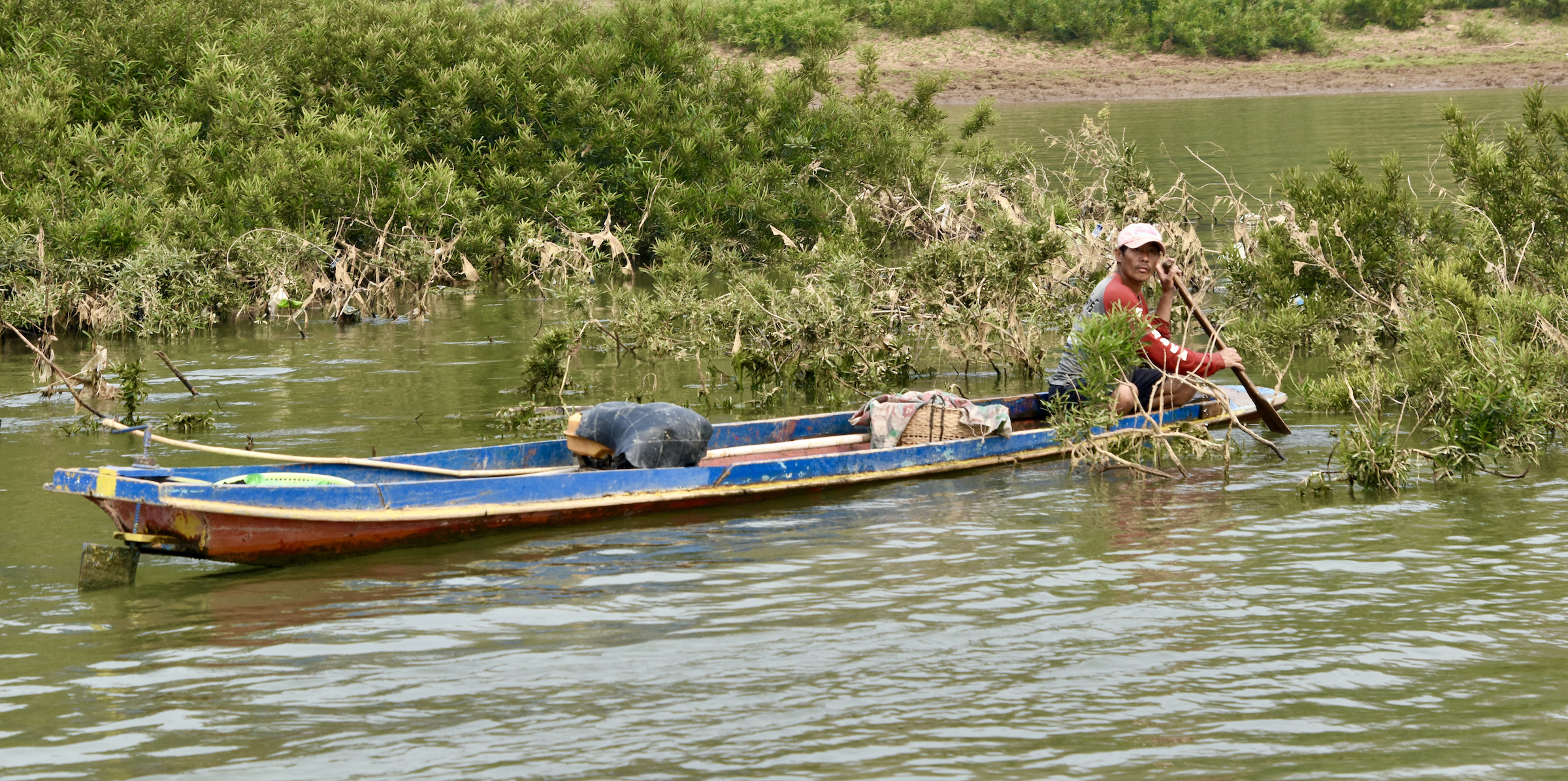 Fisherman on Mekong River Cruise