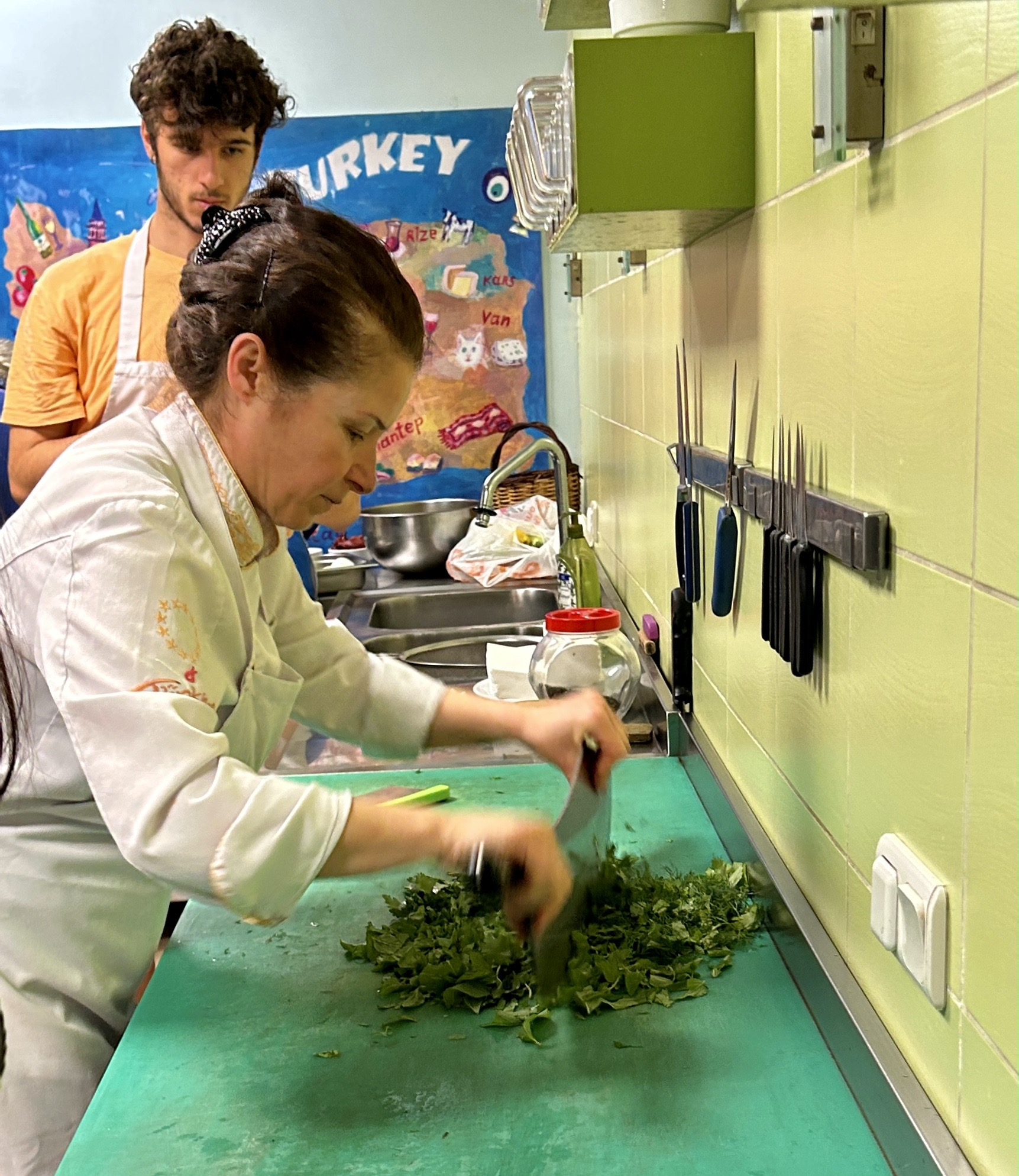 Chef Nazli Mincing Herbs, Cooking Alaturka