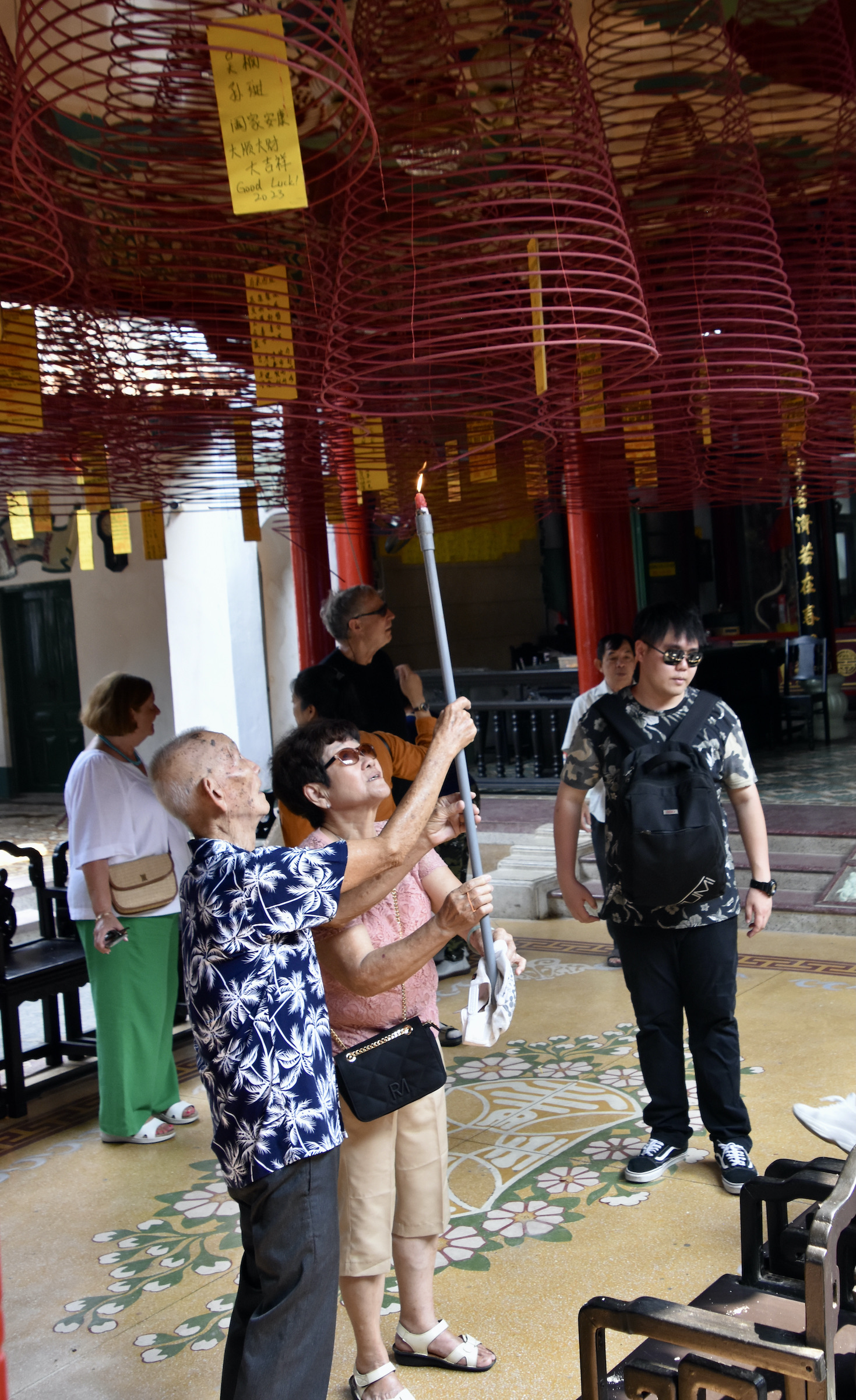 Lighting a Wish Candle, Seafarer's Temple, Hoi An