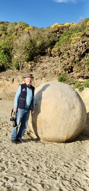 Leaning on a Moeraki Boulder
