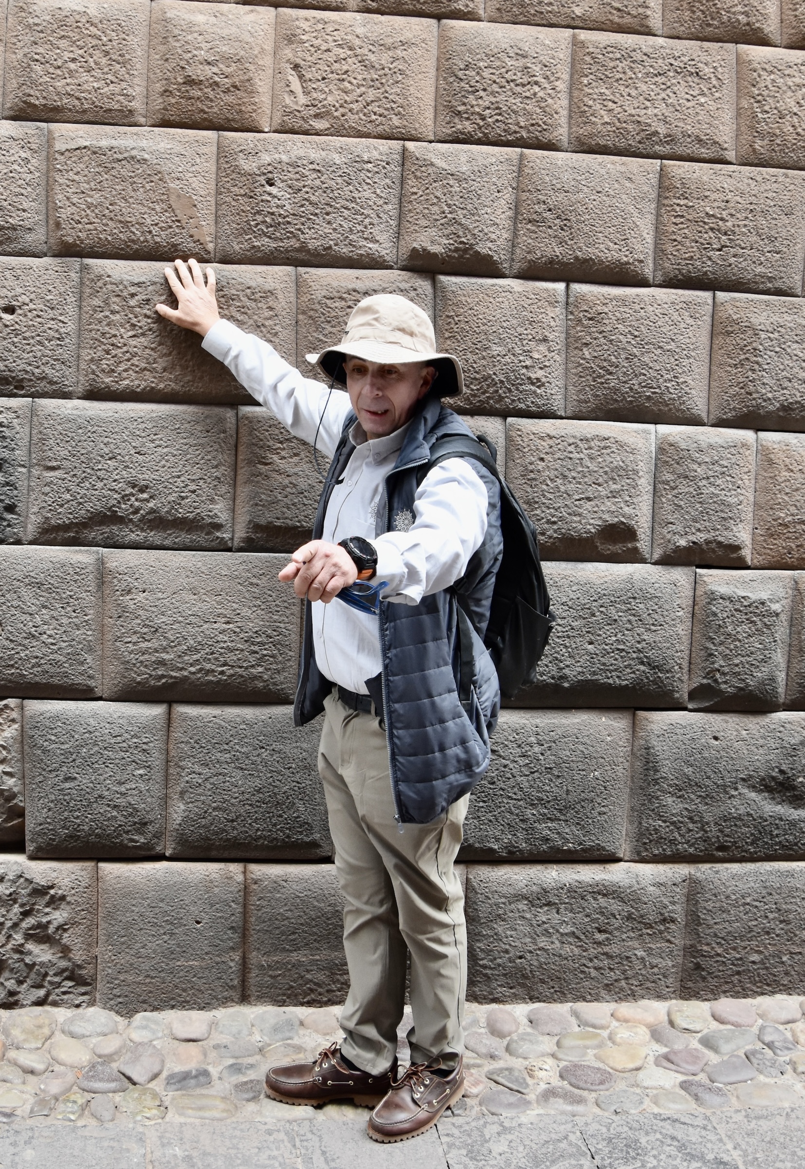 Carlos Pointing out the Walls of the Temple of the Sun, Cusco